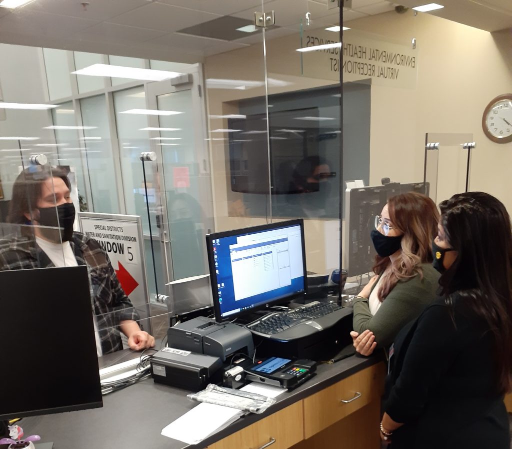 Water and Sanitation Customer Service helping a customer